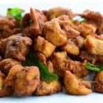indian spiced deep fried boneless chicken 65 pieces tempered with mustard seeds and curry leaves