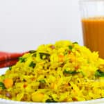 a plate kanda poha with adrak chai