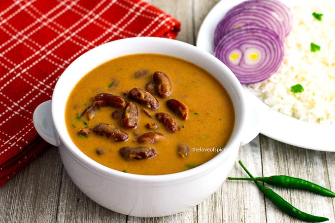 bowl of rajma with a plate of rice on the side