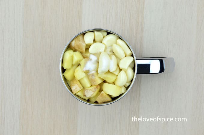 ginger cubes, garlic cloves, oil and salt in a mixer jar