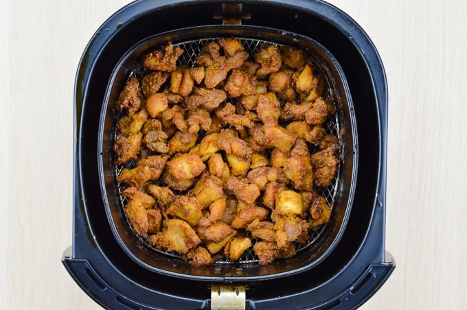 indian style air fried chicken 65 bites inside phillips airfryer basket