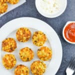 a plate full of maharashtrian style sabudana vadas with ketchup, yogurt, and extra vadas on the side