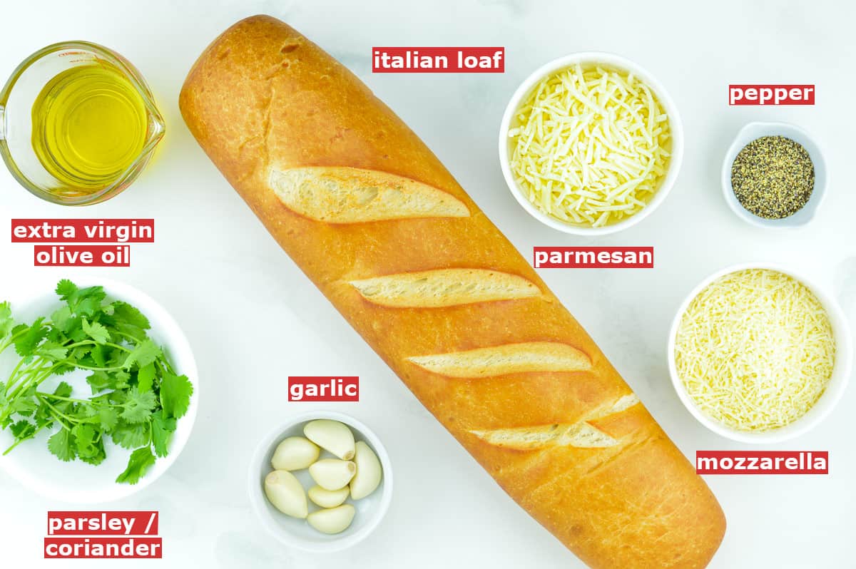 top shot of all the ingredients to make garlic bread, along with ingredient labels