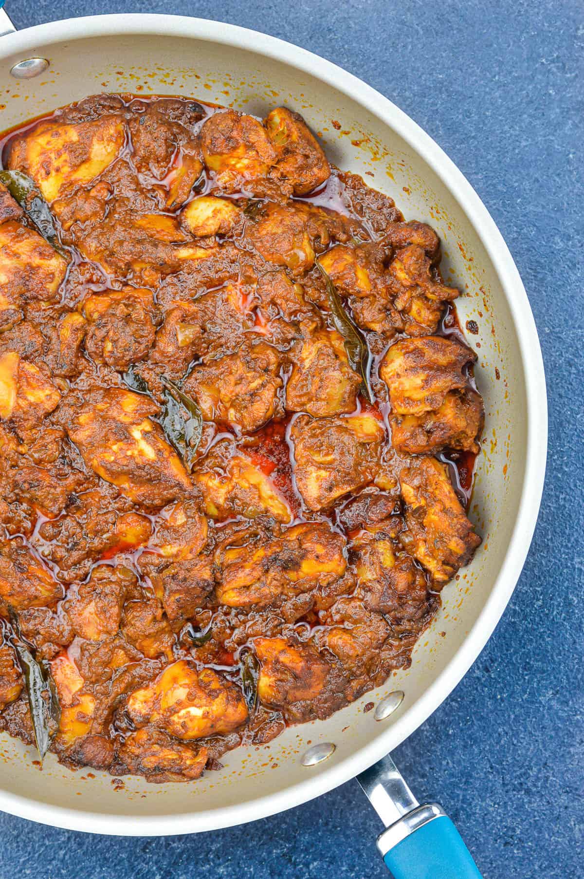 top shot of ghee roast chicken in a pan