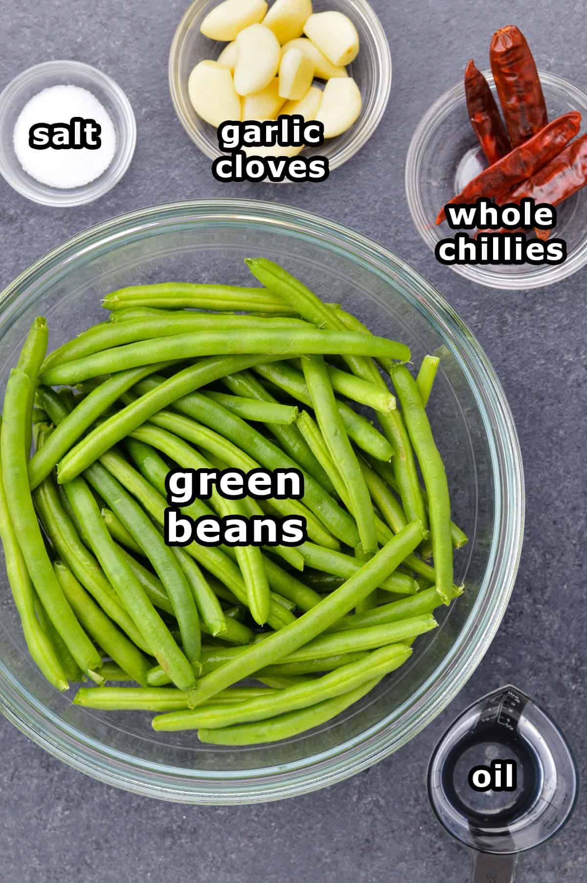 top shot of all the ingredients required to make green beans stir fry indian style.