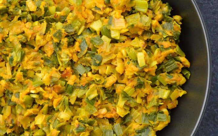 a big serving bowl of spring onion sabzi.