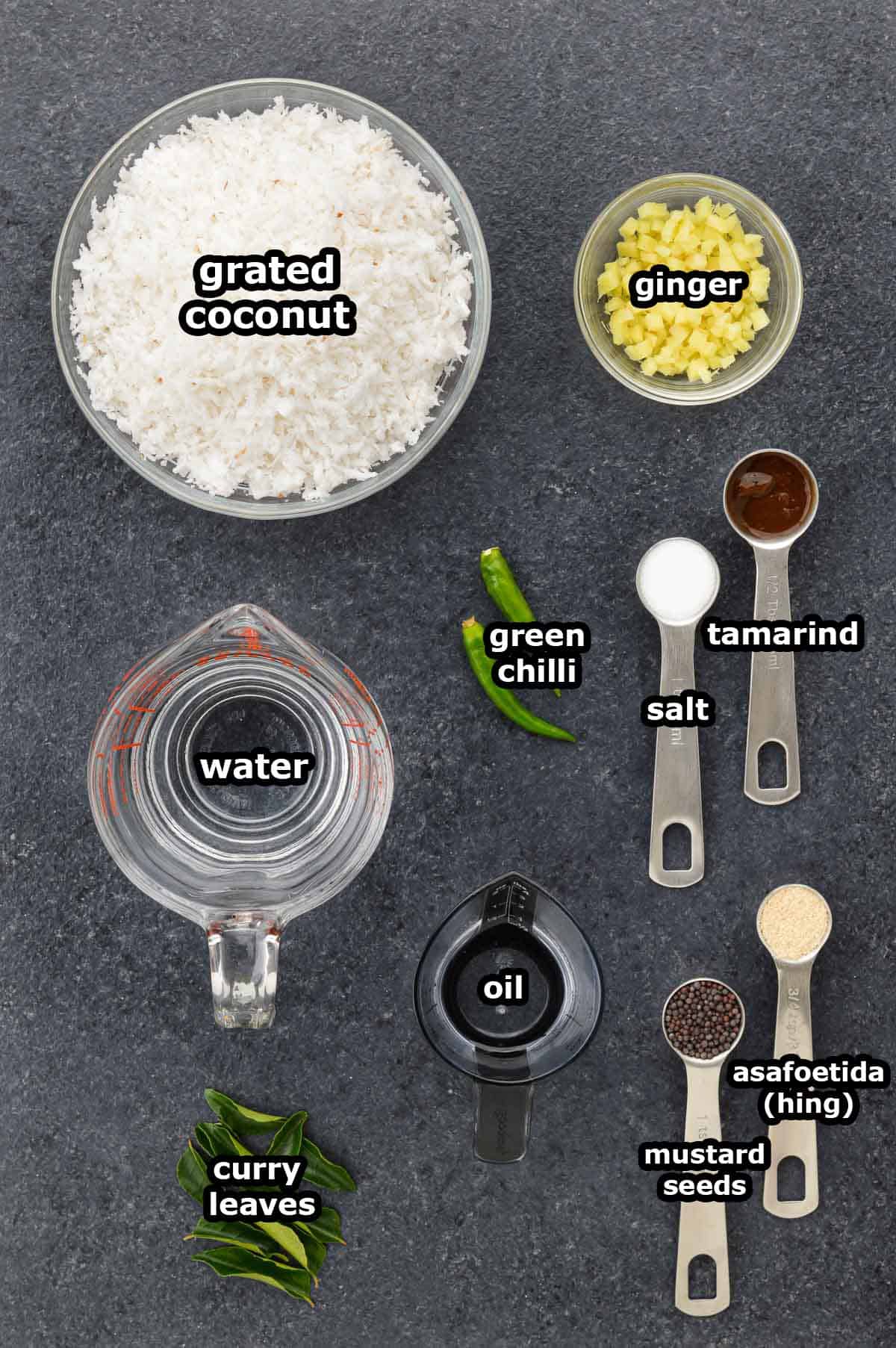 top shot of all the ingredients required to make coconut chutney, shared along with ingredient labels.