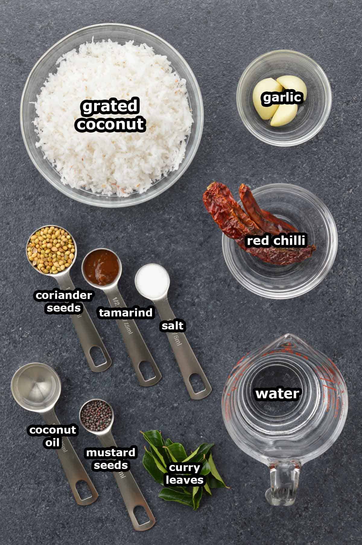 top shot of all the ingredients required to make red coconut chutney, shared along with ingredient labels.